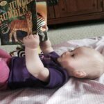 Little Cute Baby Reading a Book